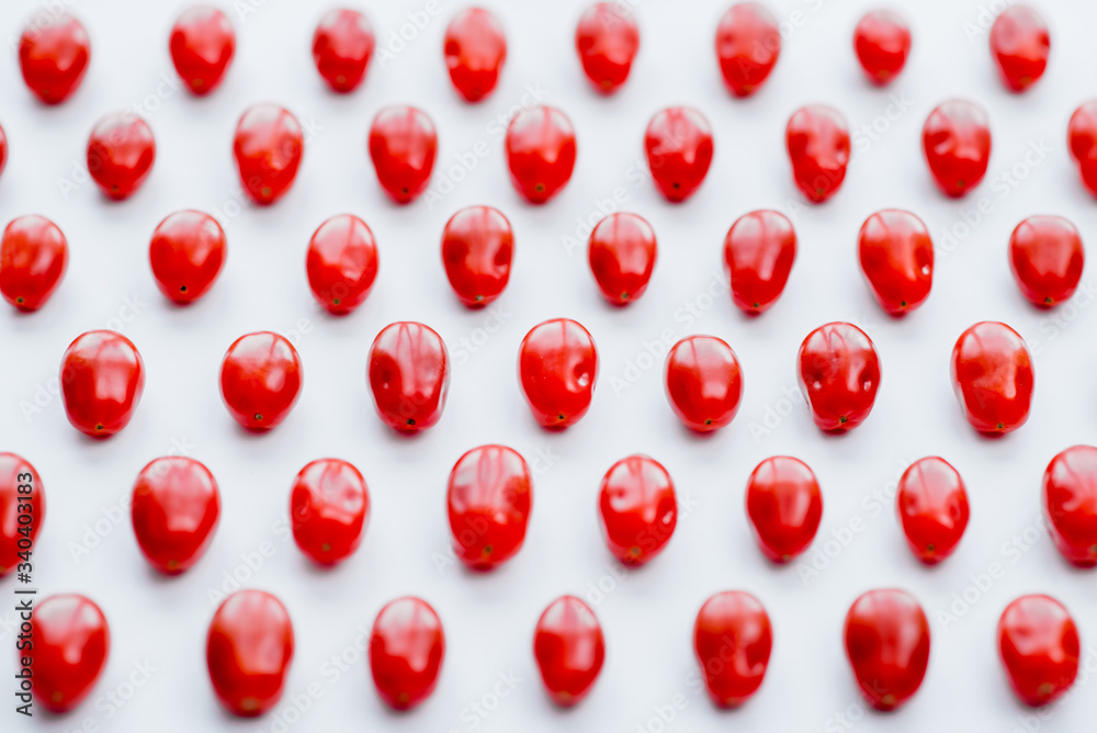 Fresh cherry tomatoes on a white background. Food isolate. Group of fresh tomatoes.