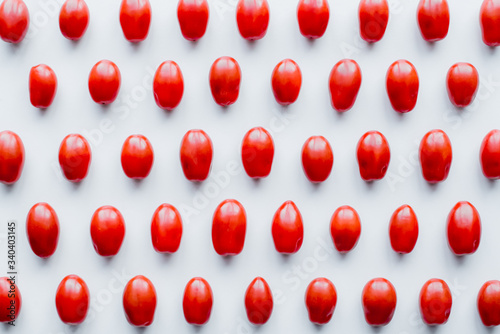 Fresh cherry tomatoes on a white background. Food isolate. Group of fresh tomatoes.