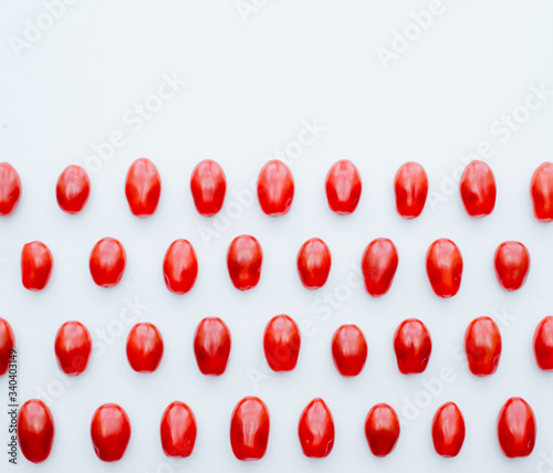 Fresh cherry tomatoes on a white background. Food isolate. Group of fresh tomatoes.