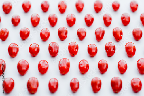 Fresh cherry tomatoes on a white background. Food isolate. Group of fresh tomatoes.