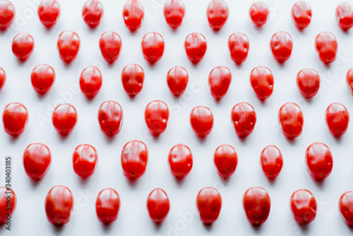 Fresh cherry tomatoes on a white background. Food isolate. Group of fresh tomatoes.
