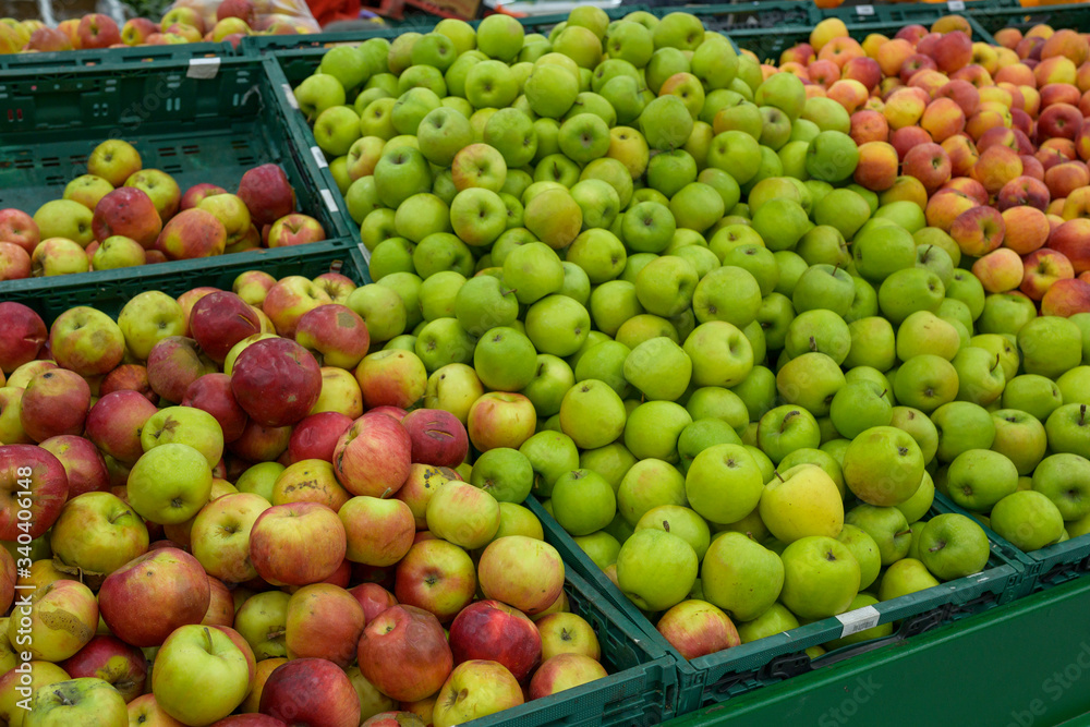 green ripe apples in a grocery store