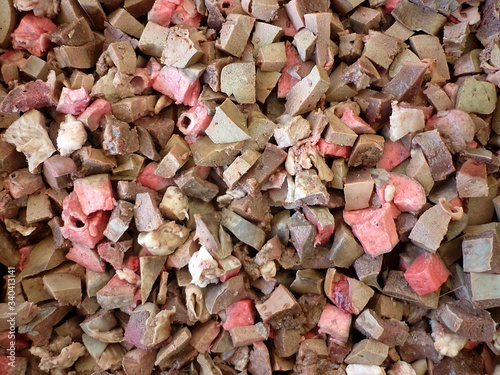 Canvas Print Raw animal intestines and offal fresh chopped, top view close up