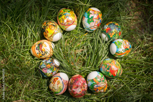  Easter eggs with different patterns on green grass.