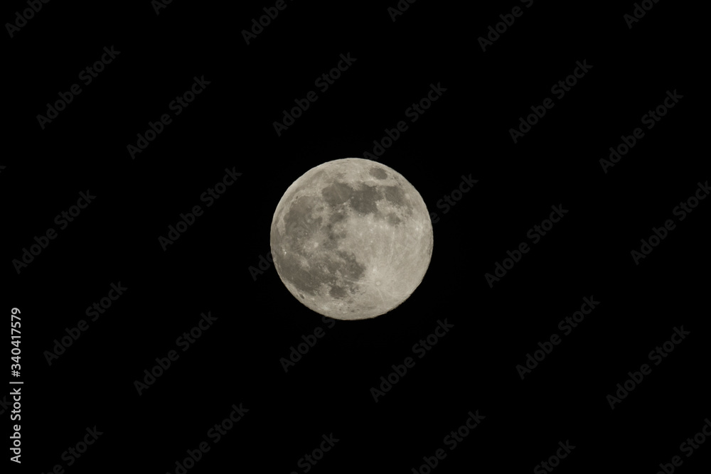 Full moon over dark black sky at night, Full moon over dark black sky at night,
