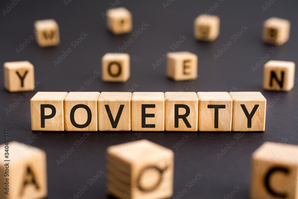 Poverty - word from wooden blocks with letters, indigence poorness poverty concept, random letters around white background Poverty - word from wooden blocks with letters, indigence poorness poverty concept, random letters around white background