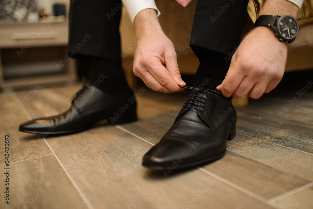 Businessman preparing for business. Suit and fashion