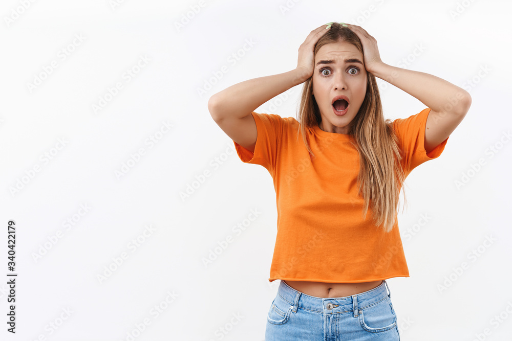 Portrait of scared and shocked, alarmed young woman feel panic over seeing something bad happened, witness terrible accident, grab head and shouting concerned, standing indesicive white background Portrait of scared and shocked, alarmed young woman feel panic over seeing something bad happened, witness terrible accident, grab head and shouting concerned, standing indesicive white background