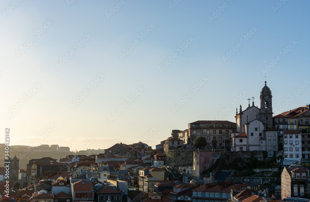 View to the historical part of the city of Porto. Sunset and sky with clouds.
