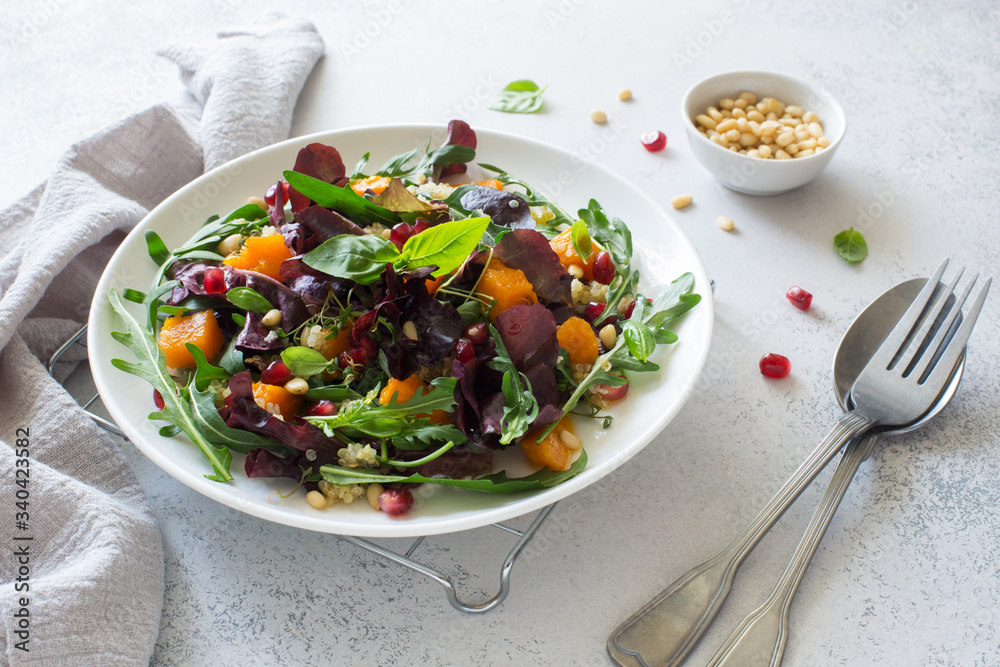 Fresh vegetable salad with pumpkin, greens and pine nuts Fresh vegetable salad with pumpkin, greens and pine nuts