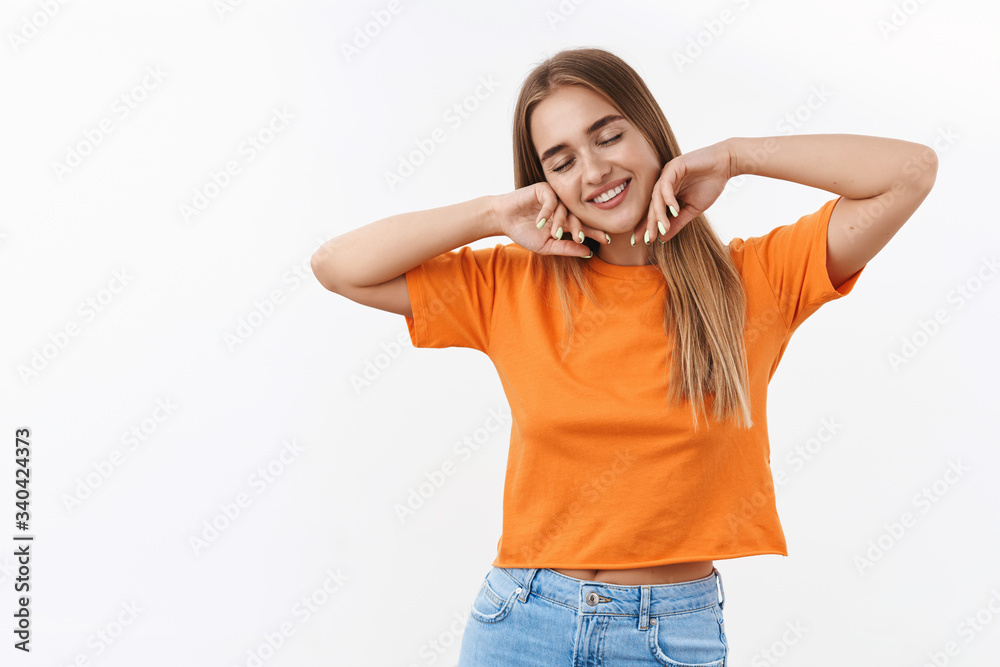 Beauty, youth and women concept. Portrait of dreamy, carefree blond girl close eyes, smiling as daydreaming, stretching hands relaxed, feel calm and overjoy, express tenderness and happiness Beauty, youth and women concept. Portrait of dreamy, carefree blond girl close eyes, smiling as daydreaming, stretching hands relaxed, feel calm and overjoy, express tenderness and happiness