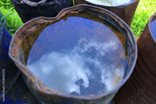 Beautiful sky reflection on water in a barrel