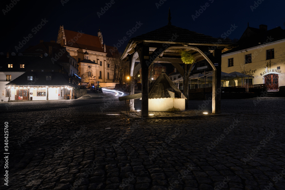 Night view on market square in Kazimierz Dolny - a lovely small town located on the right bank of the Vistula river, considerable tourist attraction.  Poland, Europe.