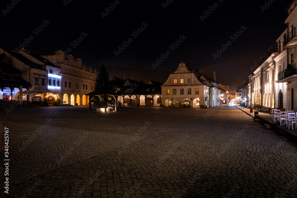 A night panorama of Kazimierz Dolny - a small town located on the right (eastern) bank of the Vistula river, considerable tourist attraction. A night panorama of Kazimierz Dolny - a small town located on the right (eastern) bank of the Vistula river, considerable tourist attraction.