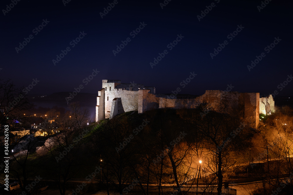 Night view of the ruins of the medieval castle (14th - 16th century) in Kazimierz Dolny -  a lovely small town located on the right bank of the Vistula river. Lublin voivodeship, Poland, Europe.