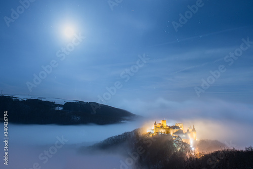 Bourscheid castle under a full moon