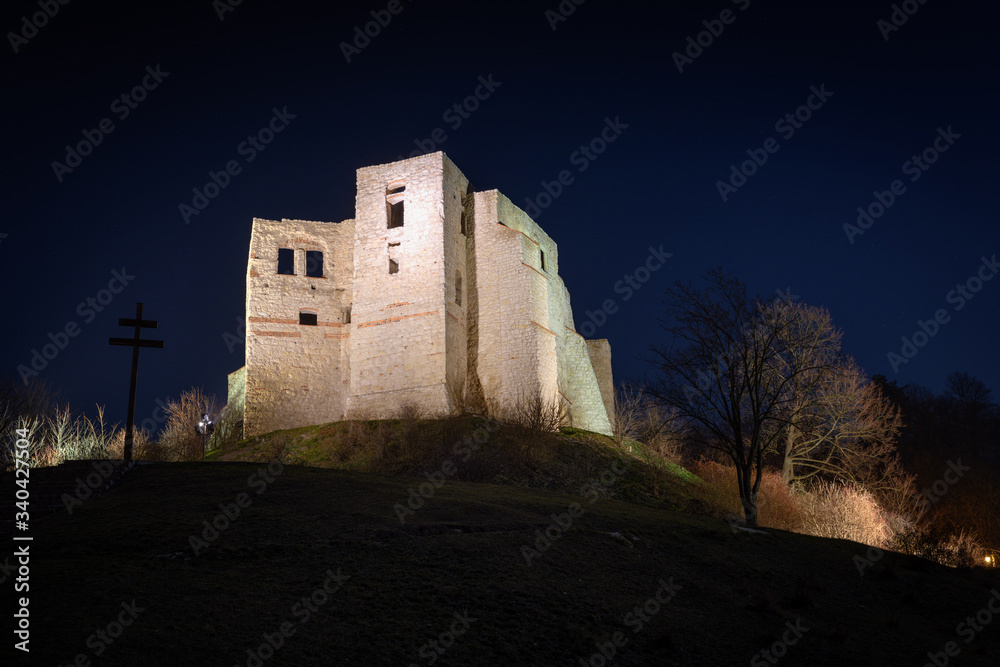 Night view of the ruins of the medieval castle (14th - 16th century) in Kazimierz Dolny -  a lovely small town located on the right bank of the Vistula river. Lublin voivodeship, Poland, Europe.