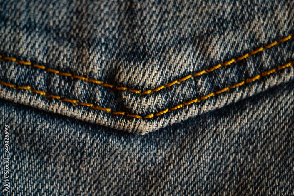 Close-up blue jean pocket to background Close-up blue jean pocket to background