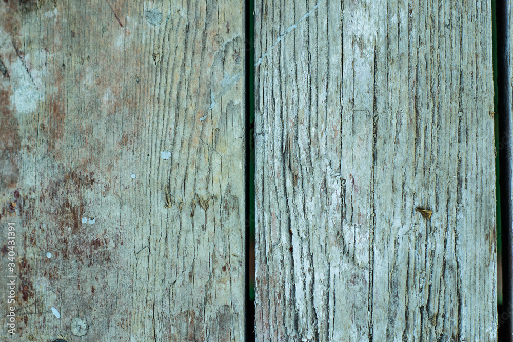 Wooden wall background in a morning light. With shadows from a window frame. Wooden wall background in a morning light. With shadows from a window frame.
