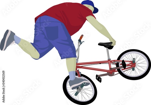boy doing bike trick on  BMX bike