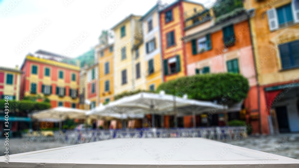 desk of free space and blurred landscape of Portofino city. 