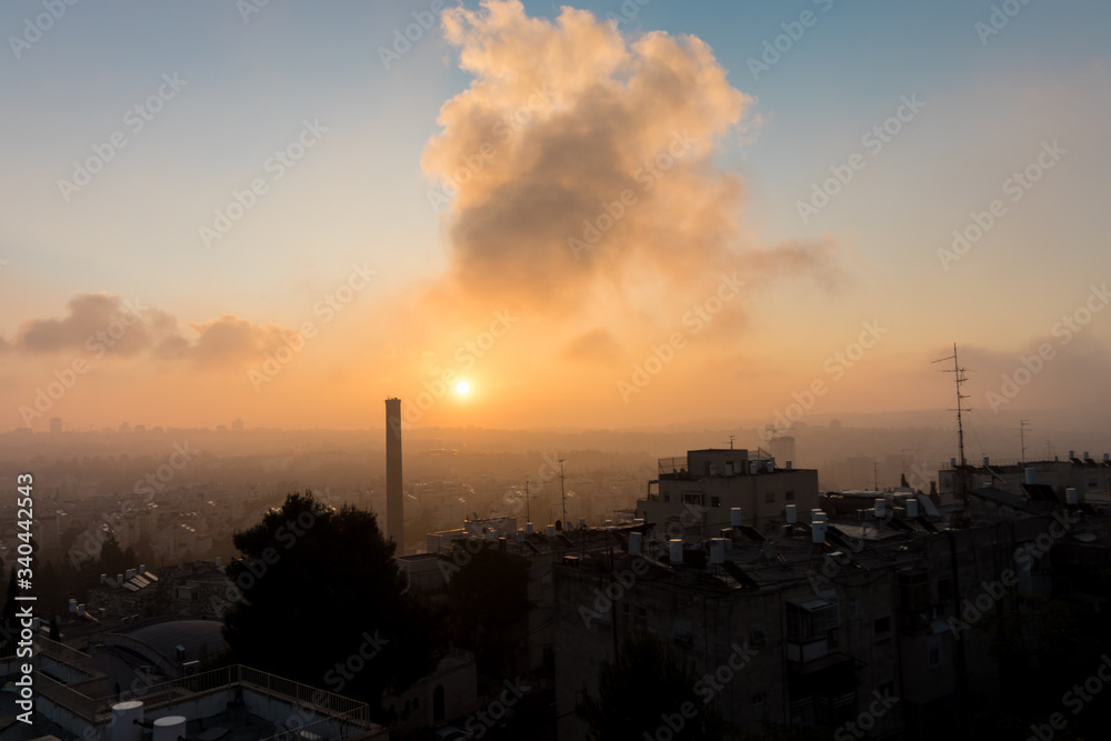 A spectacular sunrise over the roofs of the Jerusalem neighborhoods, Beit Hakerem, Beit Vagan and more