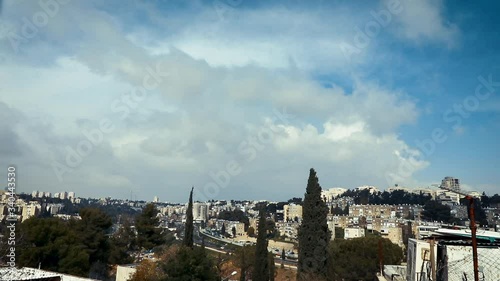 Cloudy sky against the roofs of the city of Jerusalem, the Katamon and givat mordechay neighborhood, timelapse photo