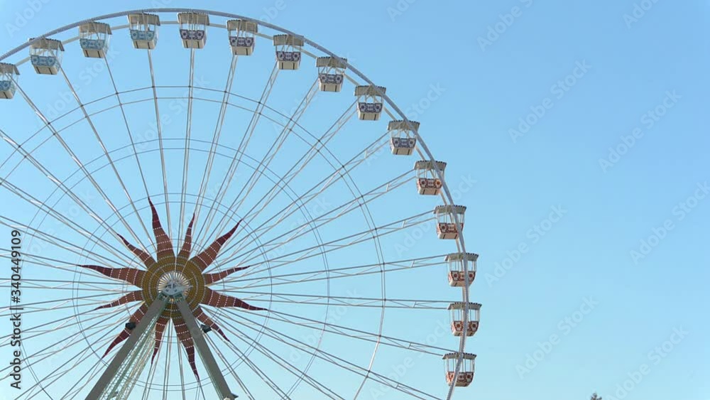 Large Ferris wheel against clear blue sky Large Ferris wheel against clear blue sky
