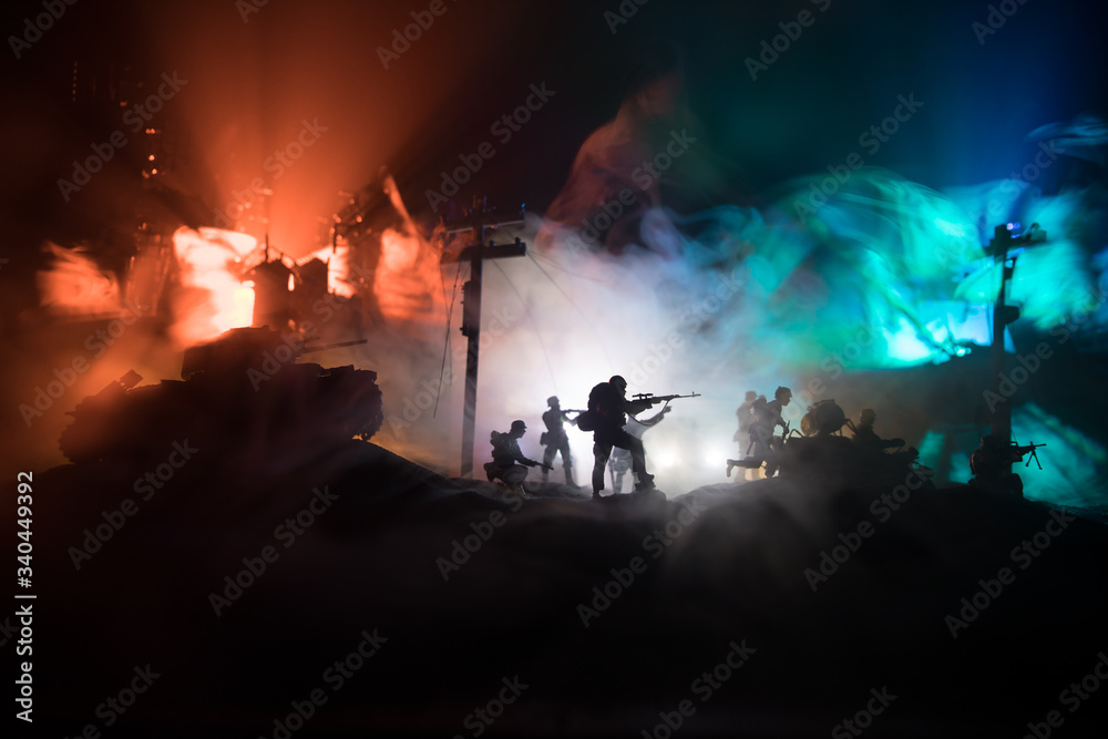 War Concept. Military silhouettes fighting scene on war fog sky background, World War Soldiers Silhouette Below Cloudy Skyline At night.