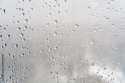 Water drops on the window, glass background in rainy weather