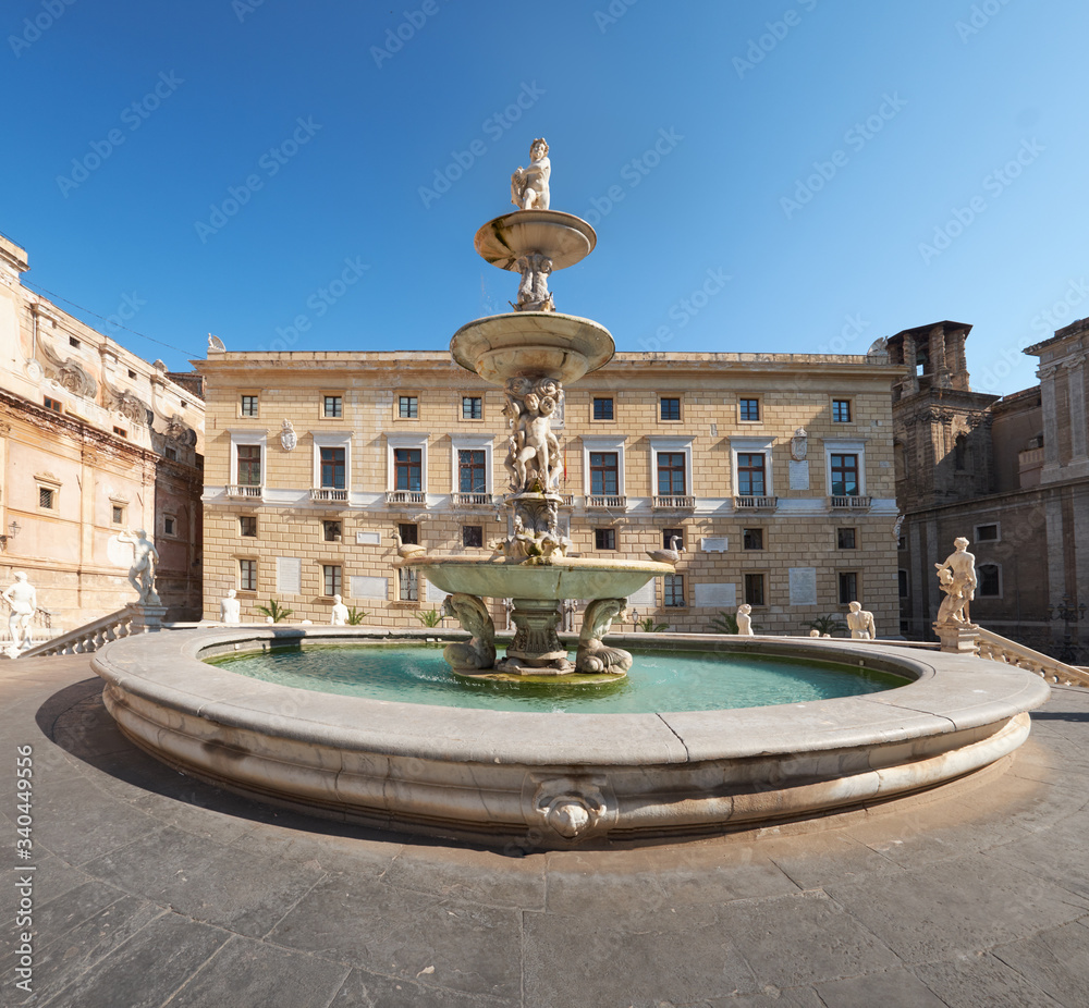 Praetorian Fountain with mythological creek Statues on Main Pretoria place in Palermo with the town hall of Palermo in the background, Sicily