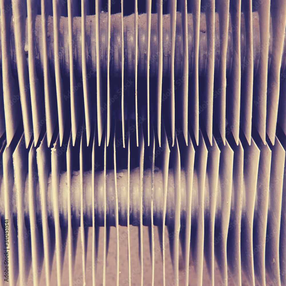 Metal radiator of a dusty old heating battery, background Metal radiator of a dusty old heating battery, background