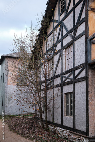 A narrow street between old houses in a vintage town of medieval Europe