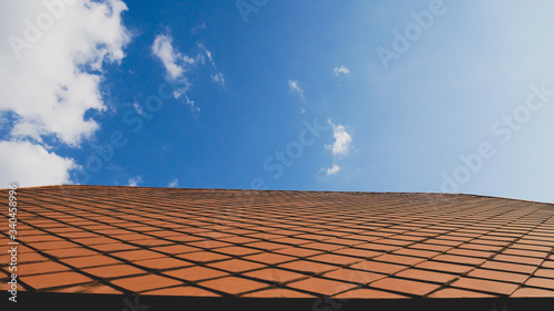 Roof on blue sky background.Concrete ceramic rooftop construction design.Structure texture detail architecture outdoor.abstract pattern exterior.Material roofing on top home.protection sunlight house