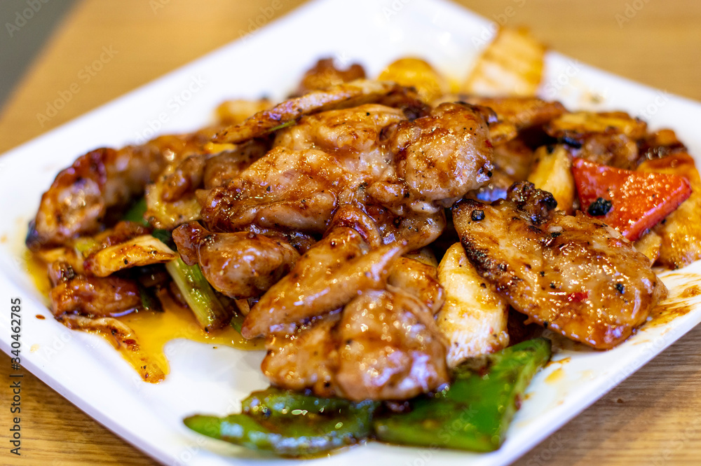 Delicious Chinese Stir Fried Pork in a White Plate