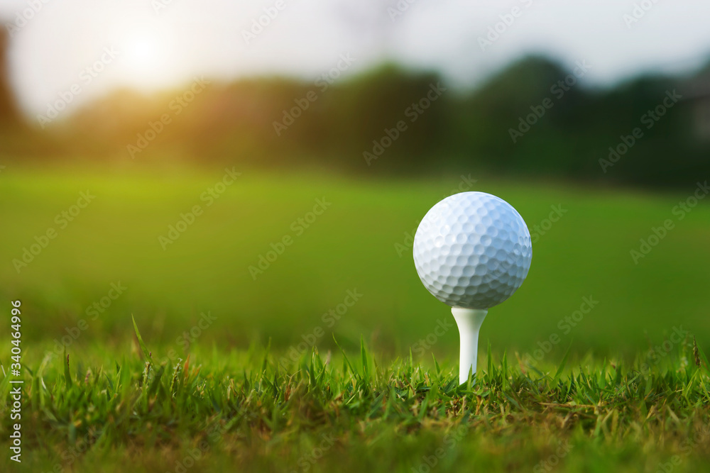 golf ball on tee in a beautiful golf course with morning sunshine golf ball on tee in a beautiful golf course with morning sunshine