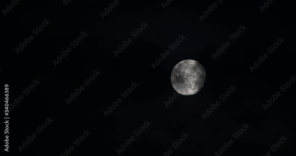 Full moon Moon with Clouds during a Storm Night clouds Pass by the moon Details are Visible on the Surface of the moon In a Dark Cloudy Night an Eerie Feeling For Horror Movies Full moon Moon with Clouds during a Storm Night clouds Pass by the moon Details are Visible on the Surface of the moon In a Dark Cloudy Night an Eerie Feeling For Horror Movies