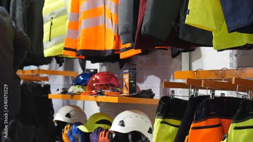 Safety workwear and personal protective equipment display in the industrial clothing shop.