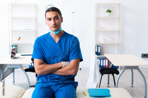 Young male doctor working in the clinic