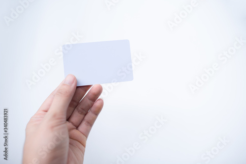 Hand hold blank business card or credit card. 