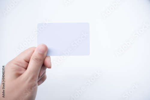 Hand hold blank business card or credit card. 