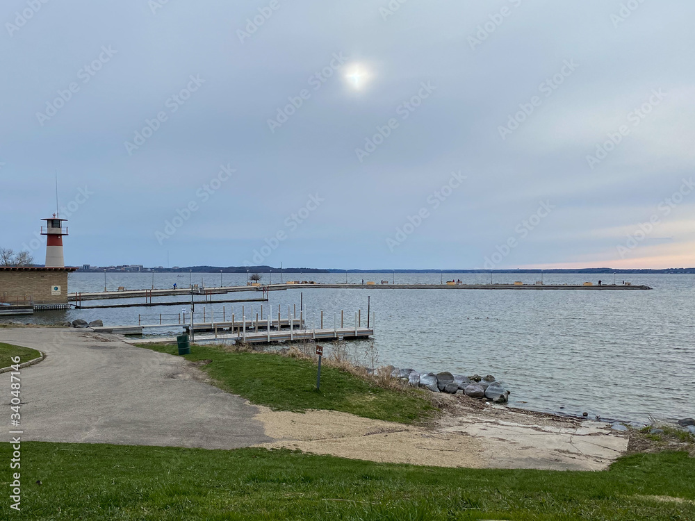 hazy sun views from the lake pier bench lake locks