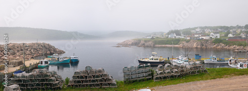 Foto Panorama of lobster traps and fishing boats at Neils Harbour Cape Breton Island