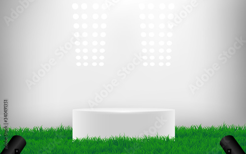 white podium on green grass with spotlight in the studio room
