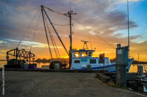 Fototapeta Naklejka Na Ścianę i Meble -  Fishing boats at sunrise.