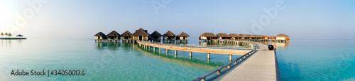 Panoramic view on water villas at tropical resort © bigguns