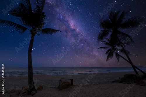 Beautiful nature fantasy - romantic beach and milky way with star. Retro style with vintage color tone. Summer season, honeymoon in night skies background concept.