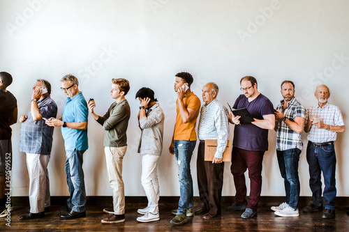 People waiting in a line for a job interview photo