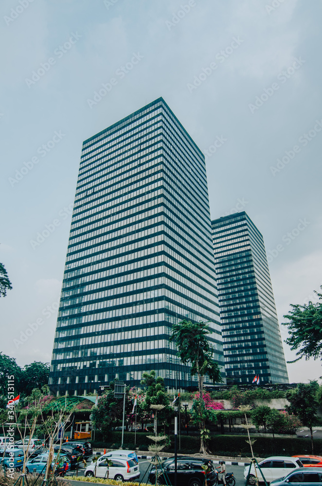 Obraz premium Jakarta, Indonesia - November 02, 2019: The business district of Jakarta along Jalan Sudirman. Jakarta is Indonesia capital city. 