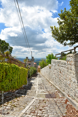 A small road between the old houses of Buonalbergo, a village in the province of Benevento photo